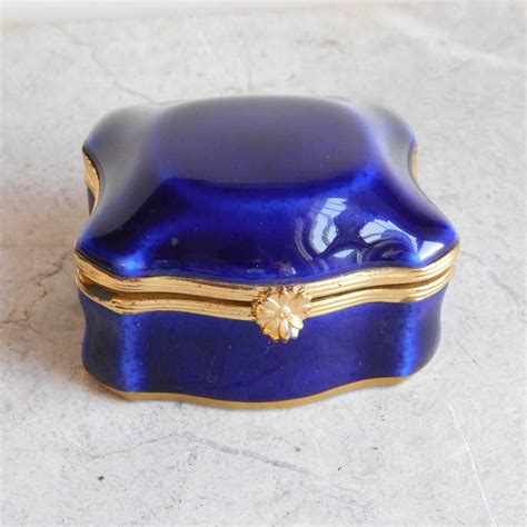 small blue metal trinket box with hinged lid|decorative trinket boxes with lids.